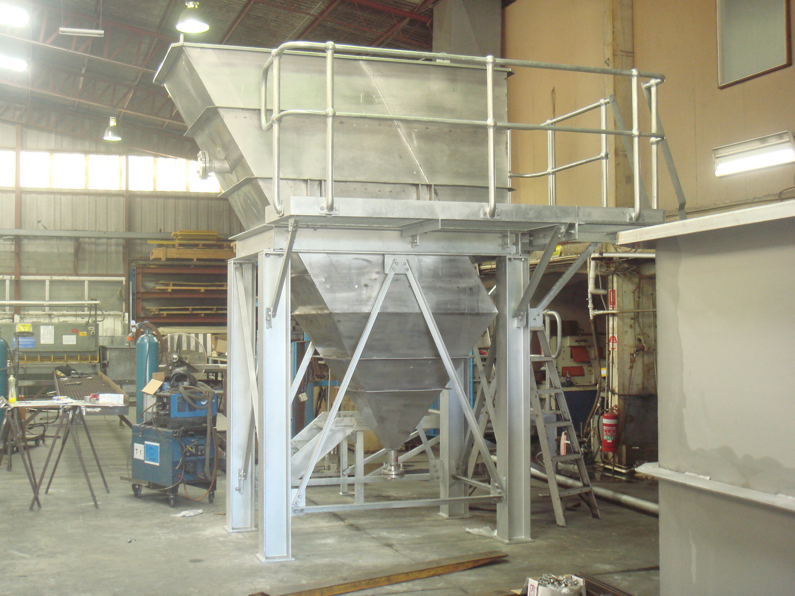 Lamella Solid Separators' large metal container in a factory